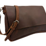 A dark brown leather shoulder bag with a wide front flap, a coordinating adjustable leather strap, and silver-tone metal hardware, shown on a plain white background.