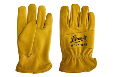 A pair of mustard yellow leather work gloves shown against a plain white background, with one glove displaying the back and the other showing the palm side with 'Laramie WORK WEAR' printed in black.