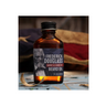 A bottle of Wolf & Iron beard oil with a label featuring a graphic of a bearded man's face, placed on a surface with a blurred background.